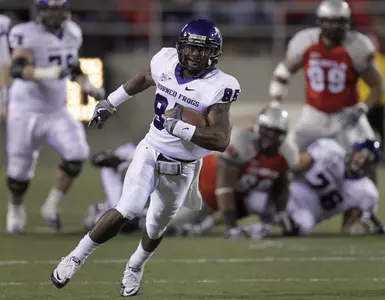 (AP) TCU wide receiver Jeremy Kerley (85) runs for a first down against UNLV in the first quarter.