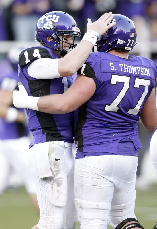 TCU quarterback Andy Dalton celebrates after a touchdown with guard Spencer Thompson.