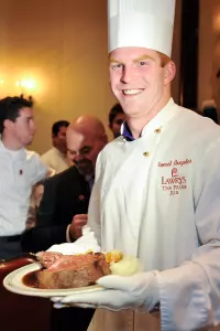 Senior Andy Dalton cut the first piece of meat at the Lawry's Beef Bowl.