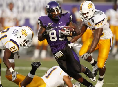TCU reciever Jeremy Kerley runs for yardage after a catch in the first half.