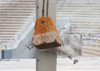 The wrecking ball smashed into the east side columns Monday.
