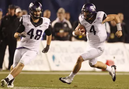 TCU quarterback Casey Pachall scrambles for a first down against Louisiana Tech as he follows fullback Luke Shivers. (AP Photo/Lenny Ignelzi)