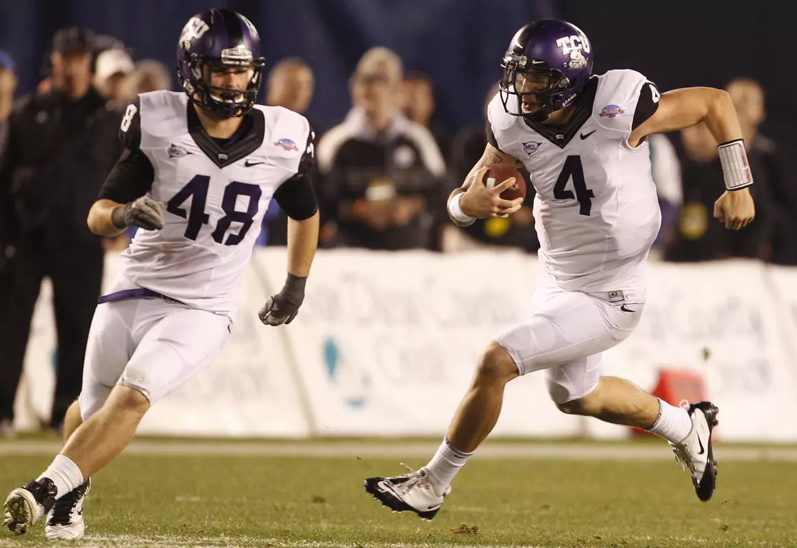 TCU quarterback Casey Pachall scrambles for a first down against Louisiana Tech as he follows fullback Luke Shivers. (AP Photo/Lenny Ignelzi)