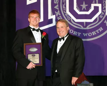 Former TCU quarterback Andy Dalton with head coach Gary Patterson at Saturday's football team banquet.