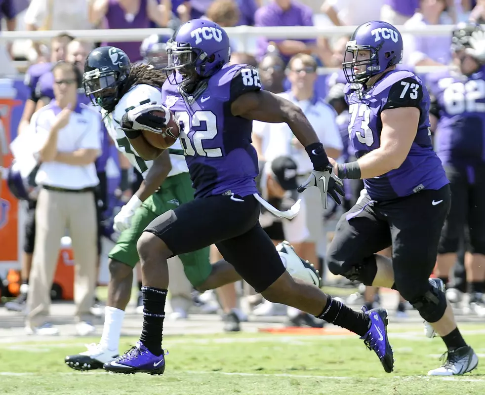 TCU wide receiver Josh Boyce (82) runs for a touchdown during the second quarter.