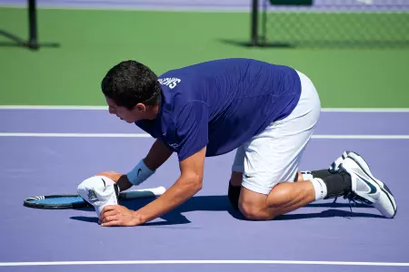 Senior Daniel Sanchez kissed the court folliowing his final home match, a 6-2, 6-2 win.
