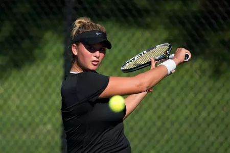 Millie Nichols returns a shot during action on day one of the USTA/ITA Regionals.