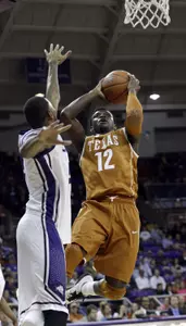 Connell Crossland defends Texas guard Myck Kabongo. (AP Photo/LM Otero)