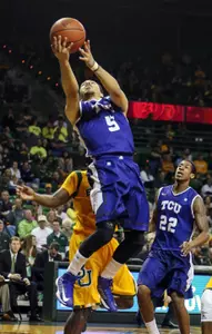 Kyan Anderson (5) shoots during the first half