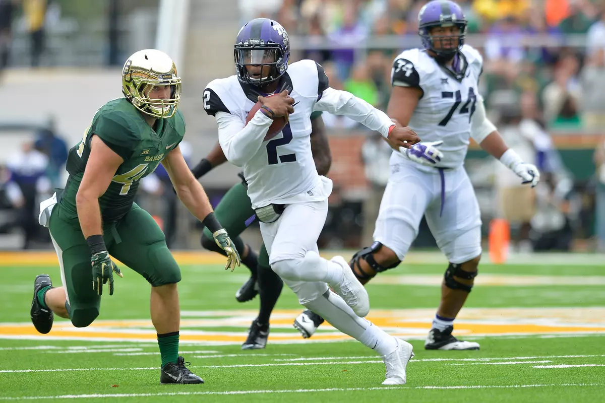Trevone Boykin looks for running room in the first half.
