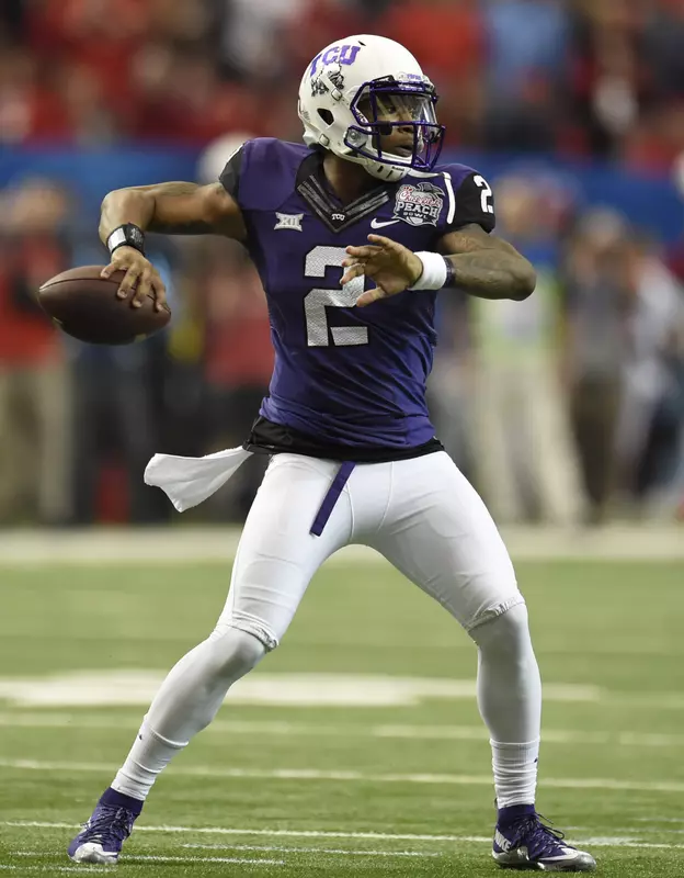 Trevone Boykin (2) passes the ball during the first quarter against the Rebels.