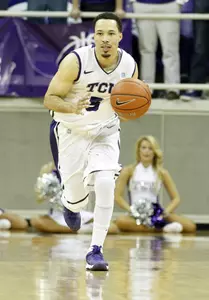 Kyan Anderson dribbles the ball up court during the second half.