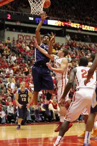 Center Karviar Shepherd (1) shoots over Cyclone defense.