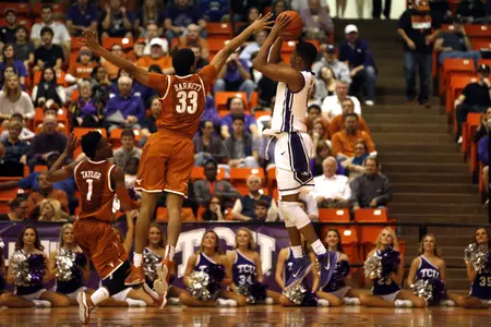Brandon Parrish shoots over Jordan Barnett.