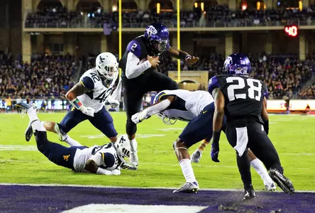 Quarterback Trevone Boykin (2) leaps for a touchdown