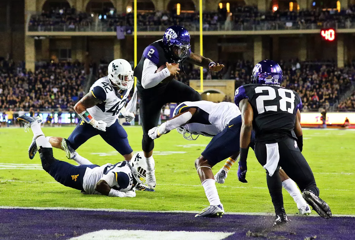 Quarterback Trevone Boykin (2) leaps for a touchdown