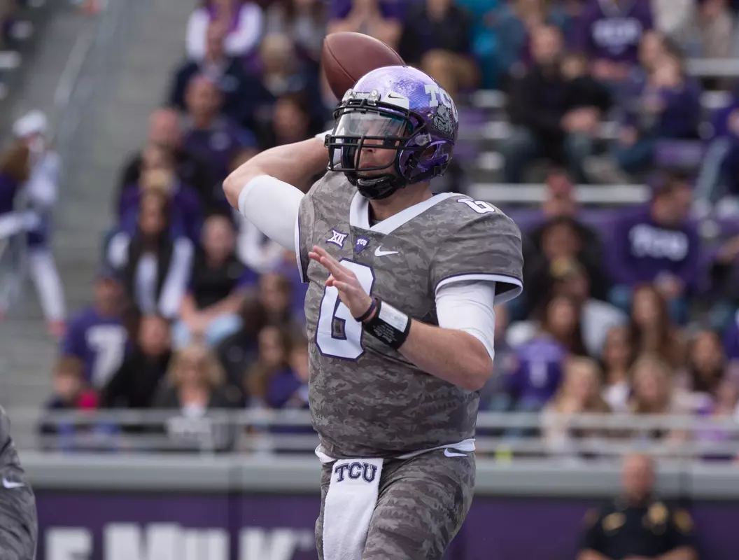 QB Bram Kohlhausen (6) drops back to pass during the first half.