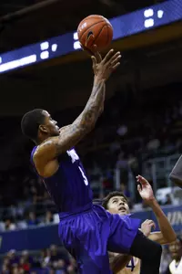 Malique Trent led the team with 13 points in loss to the Huskies.