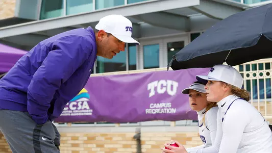 Coach Gutierrez talks to Jensyn Bledsoe and Claire Doyle