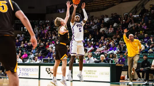Micah Robinson shoots a 3-pointer against Wyoming.
