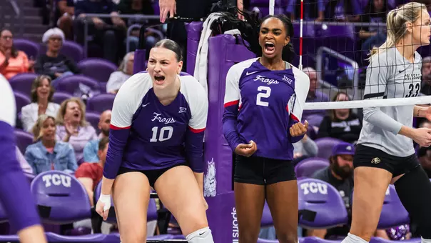 Kinsley Young and Evan Hendrix celebrate after a block against Colorado