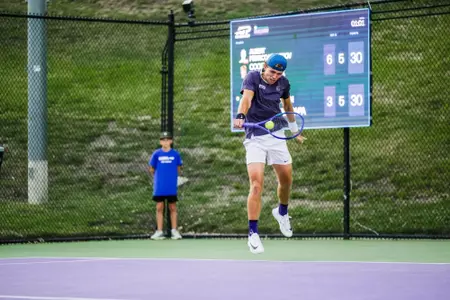 Albert Pedrico jumping and hitting a one handed backhand