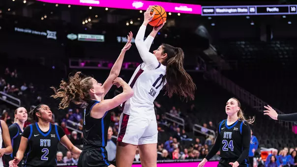 Clara Silva rises to attempt a layup in the Big 12 Tournament quarterfinals
