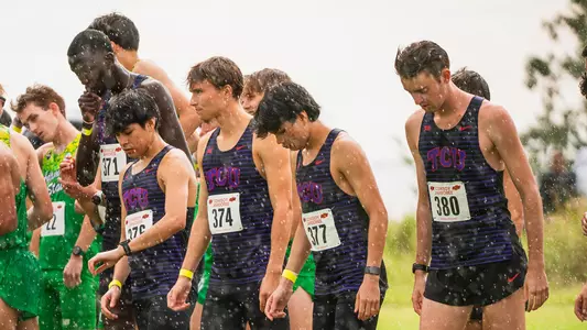 TCU cross country waits at the starting line in the rain