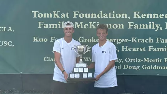 Matthieu Chambonniere and Maximus Dussault hold the Battle in the Bay Classic championship trophy