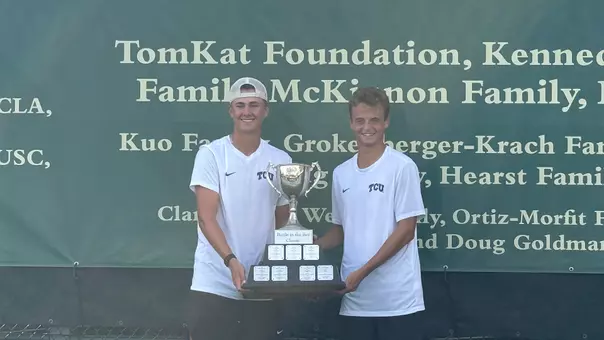 Matthieu Chambonniere and Maximus Dussault hold the Battle in the Bay Classic championship trophy
