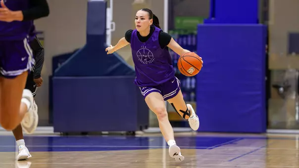 Jessie-May Hall pushes the ball up court in transition during a scrimmage.
