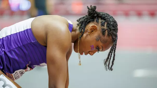 Amari Kiluvia getting ready for a race in the starting block.