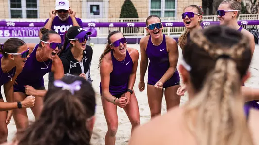 TCU beach volleyball team cheering