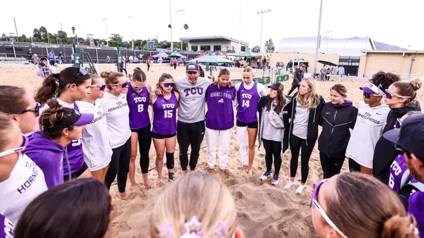 TCU beach volleyball team huddle