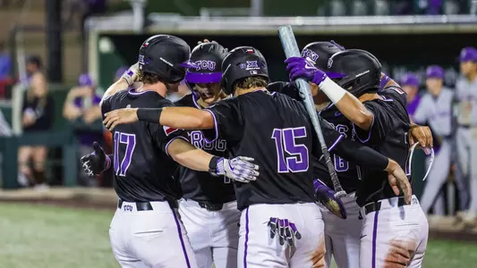 Rob Liddington celebrates his grand slam, hugging his teammates at home plate against Tarleton State on April 14, 2026.