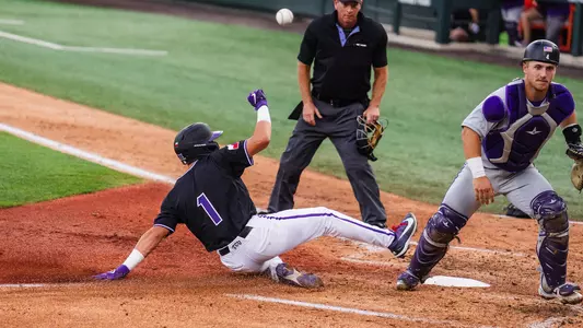 Jack Bell slides across home plate safely, scoring on a sacrifice fly against Tarleton State on April 14, 2026.