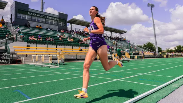 TCU track's Georgia Scott races down the track, passing the Markwardt Pressbox at Baylor's Clyde Hart Track & Field Stadium.