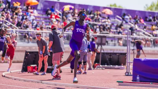 TCU Track's Mohamed Kowa runs around the track in the 1500m race.