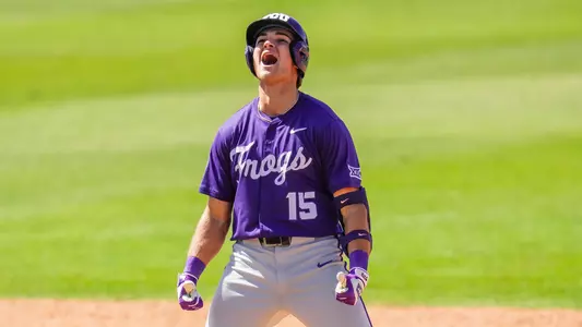 Chase Brunson celebrates his go-ahead, two-run double at second base in a win over Baylor