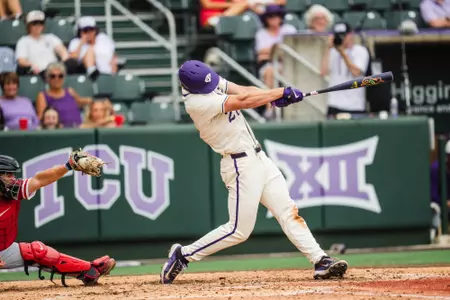 Brady Dallimore swings and doubles on a pitch against Houston.