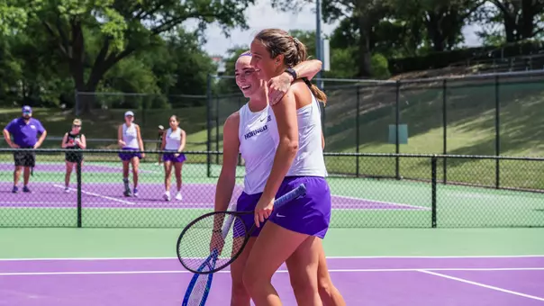 Raquel Caballero Chica and Jennifer Jackson smiling and hugging each other