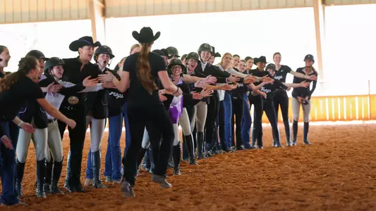 TCU equestrian team celebrating an MOP after the meet