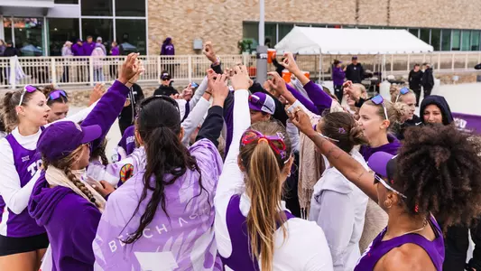 TCU beach volleyball team huddle