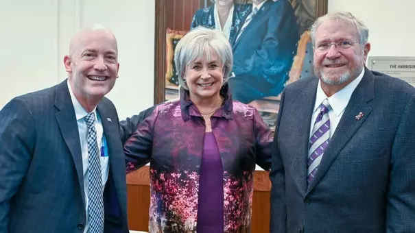 Mike and Brenda Harrison (right) with Chancellor Emeritus Victor Boschini