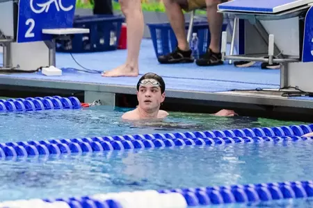 Braedon Ando looking at the scoreboard after finishing a race