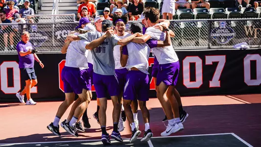 The TCU men's tennis team celebrates after clinching a 4-3 victory over Ohio State.