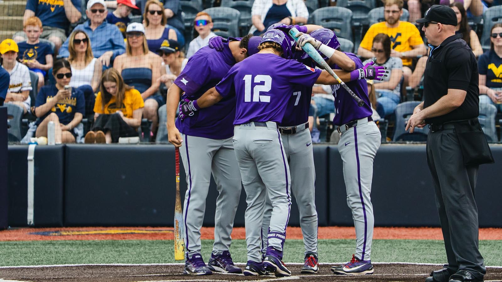 Kyuss Gargett greets teammates at home plate.