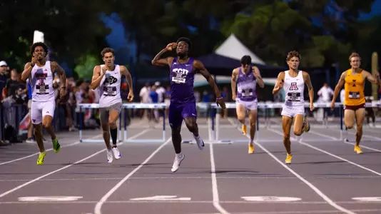 TCU track's Jayden Douglas celebrates as he crosses the finish line in the 400m hurdles