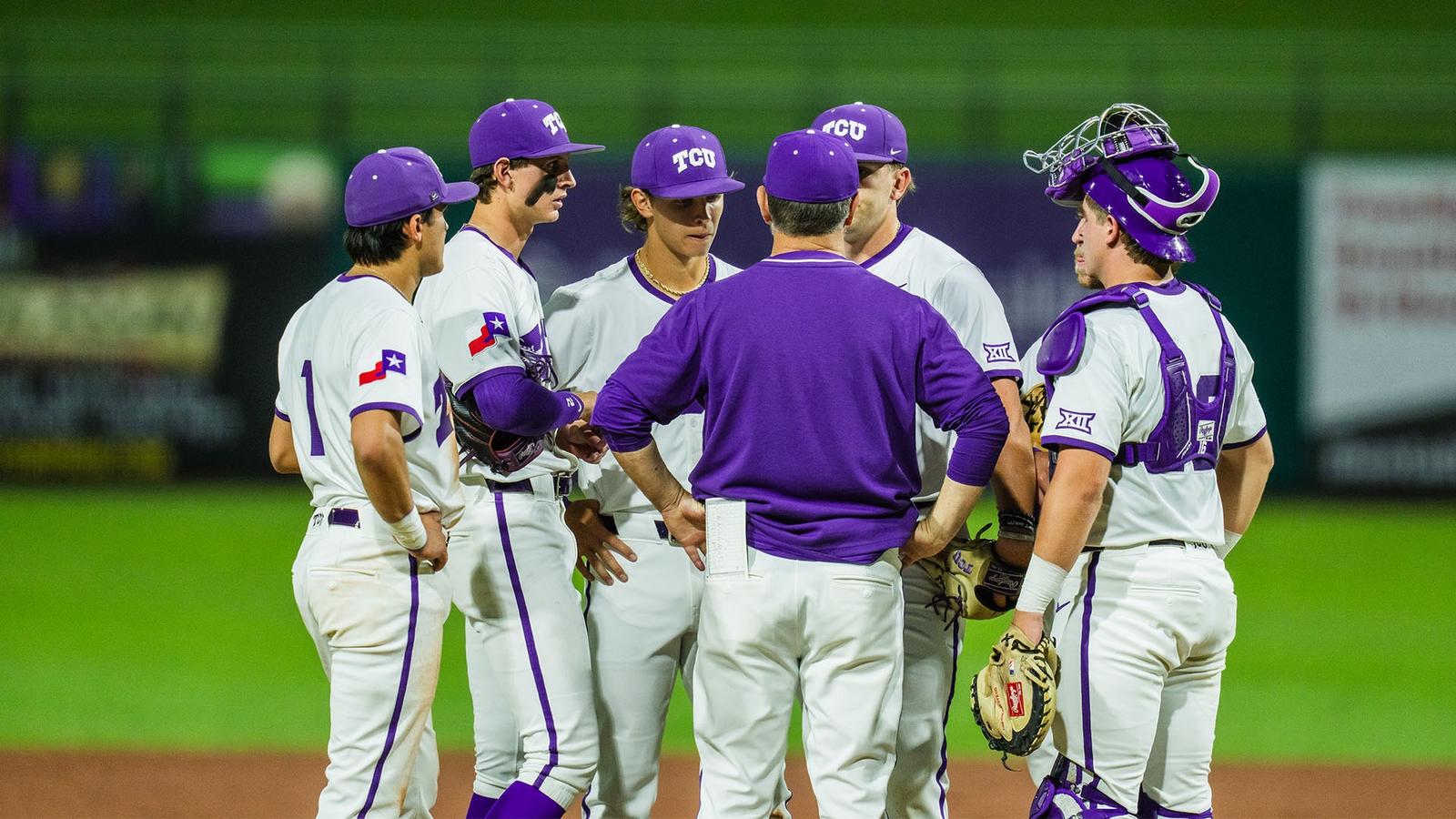 The team huddles on the mound.