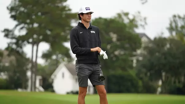 Sam Udovich stands and adjusts his glove before attempting a shot